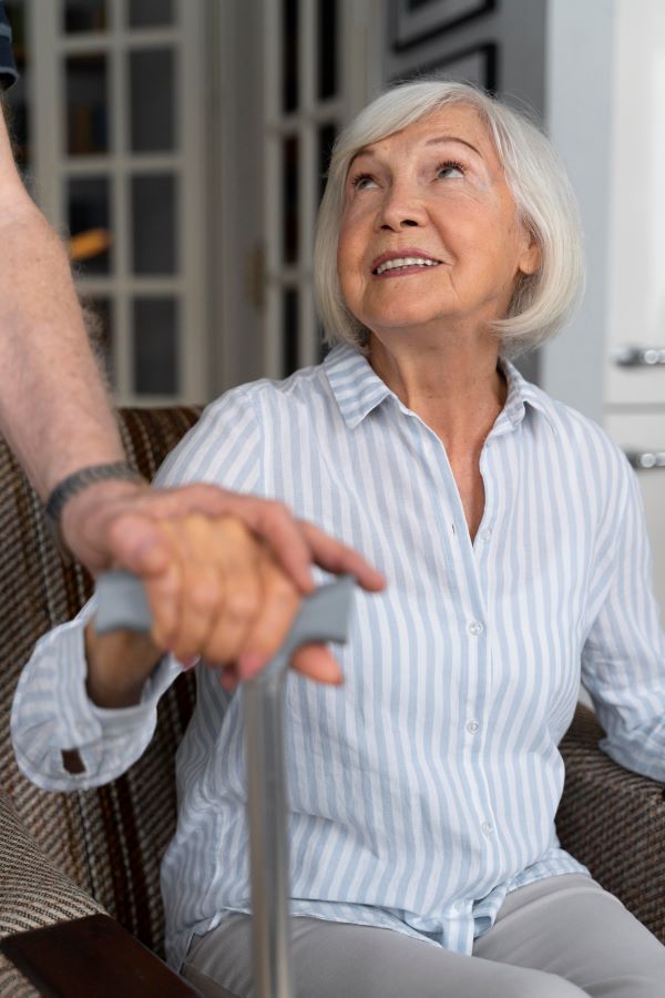 Senior holding a cane